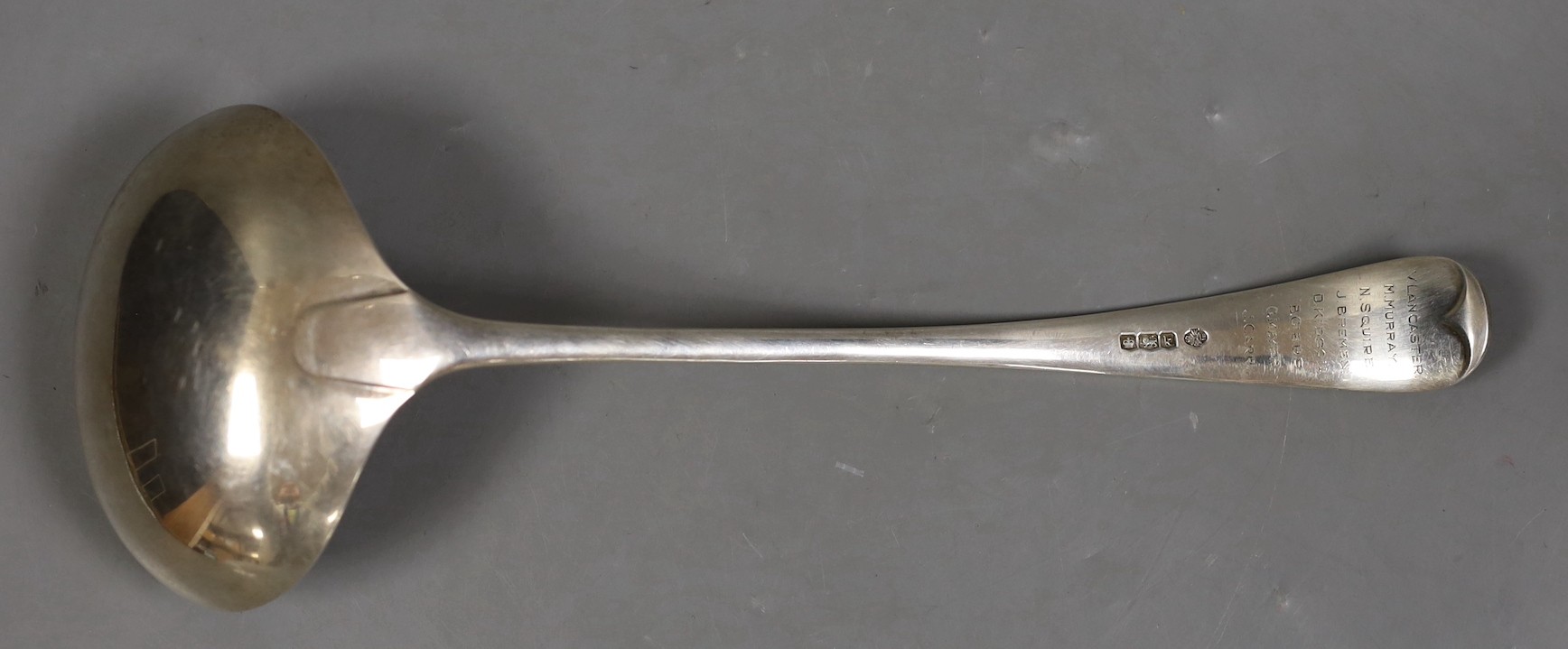 A George V silver Old English pattern soup ladle, William Hutton & Sons, Sheffield, 1927, engraved with names, 28.5cm, 8.1oz.